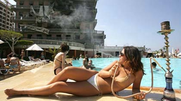 Rallying from devastation is typical of Beirut ... enjoying the pool of bombed landmark the Saint-Georges hotel.