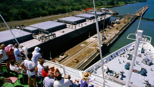 Incredible ... passengers watch as their ship passes through the gates of a lock.