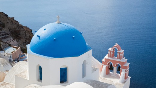 Coastal odyssey: An iconic blue-domed church on the Greek island of Santorini.