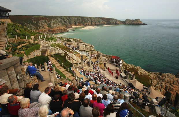 Crowds watch a Shakespeare play at Minack Theatre near Penzance, Cornwall.