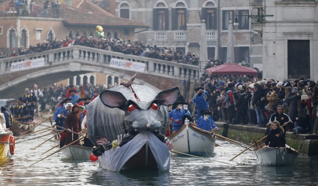 Boats sail during the water parade, part of the Venice Carnival, in Venice, Italy. The Venice carnival in the historical ...