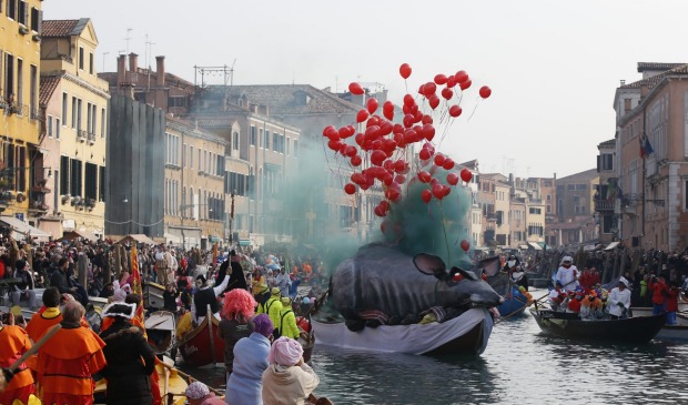 Boats sail along Rio Cannnaregio during the water parade, part of the Venice Carnival, in Venice, Italy. The Venice ...