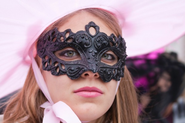 A masked woman in Venice, Italy. The Venice carnival in the historical lagoon city attracts people from around the world.