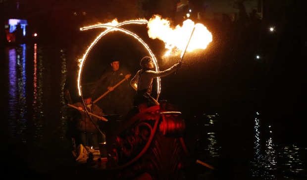 Artists perform with fire at Rio Canneregio for the Carnival Grand Opening show, in Venice, Italy. The Venice carnival ...