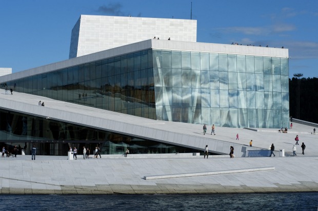 One of the best waterfront buildings: The Opera House, Oslo, Norway.Pitched courtyards in white granite and marble rise ...