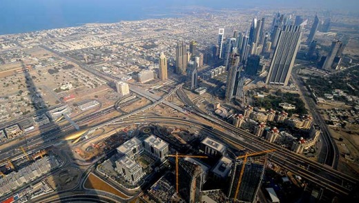 The shadow of the Burj Khalifa looms over the city of Dubai.