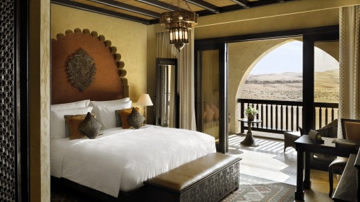 A deluxe balcony room with views across the desert.