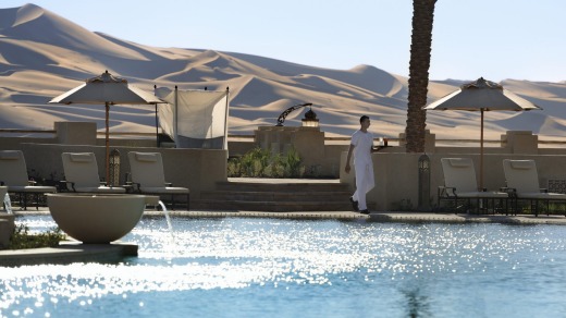 'Sunshine butlers' help keep the guests cool by the pool.