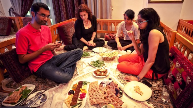 Enjoying a traditional Iranian meal.