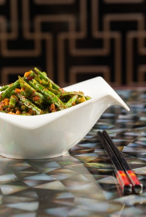 A Szechuan style sauteed string beans with minced chicken dished served at the Yuan.