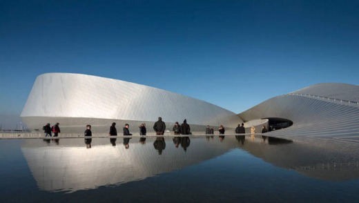 Copenhagen's Den Bla Planet (The Blue Planet) aquarium is encircled by a reflection pool.