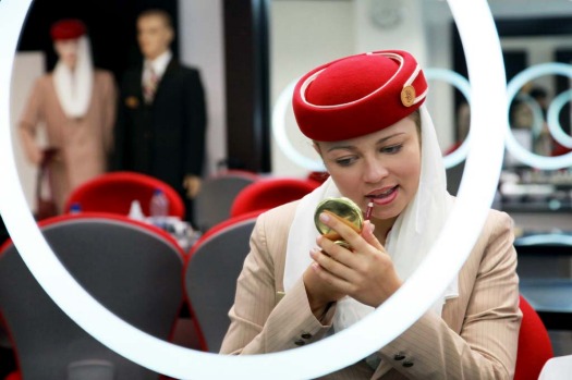 Polina Sasko, an flight attendant student with Emirates, applies lip liner during a make-up training session at the ...