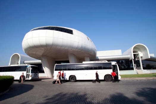 Emirates Airline staff board buses outside the Emirates Aviation College in Dubai.