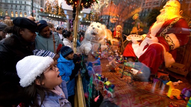 A child admires the Christmas window display at Macy's department store in midtown Manhattan.
