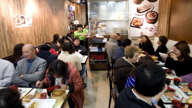 Customers eat at Tim Ho Wan 32-seat restaurant in Hong Kong.