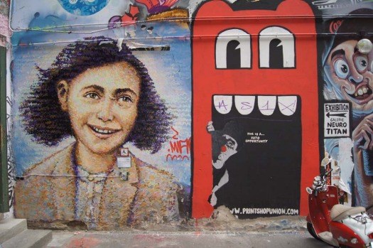 An artwork (left) created by Australian Jimmy C outside Berlin's Anne Frank Museum.