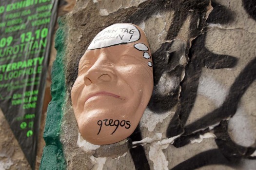 A giant astronaut covers a building wall in Berlin, created by artist Victor Ash.