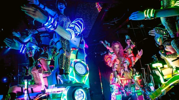 Dancers perform on large scale female robots during a show at The Robot Restaurant in Tokyo, Japan.