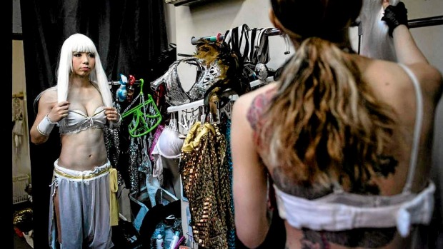 Performers  change into their costumes backstage prior to the start of a show at The Robot Restaurant in Tokyo, Japan.