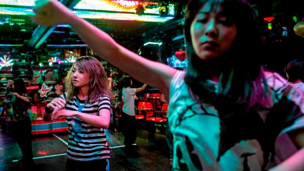 Dancers rehearse prior to the start of a show during a show at The Robot Restaurant in Tokyo, Japan.