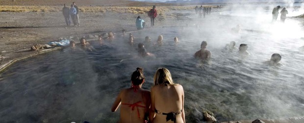 Tourists bathe in hot springs near the small village of Agua Brava, more than 4000 meters above sea level, in the Uyuni ...