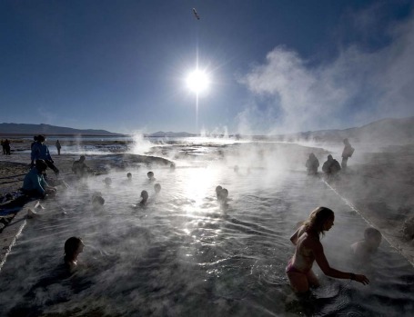 Tourists bathe in hot springs near the small village of Agua Brava, more than 4000 meters above sea level, in the Uyuni ...