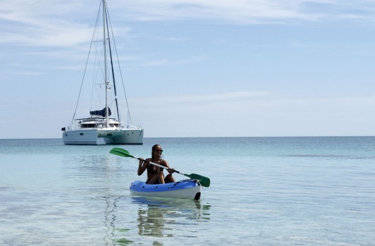 Kayaking off a catamaran in French Polynesia.