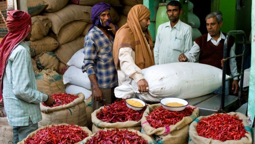 Businessmen and porters at a stall selling red chillies at the Old Delhi Spice Market in Khari Baoli Road.