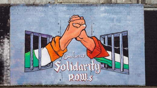 These walls can talk: A political mural in Belfast, Northern Ireland.