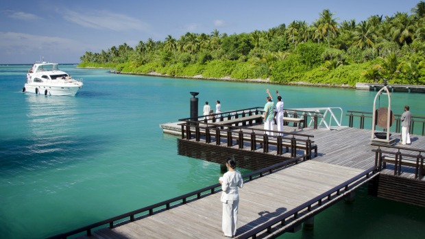Guests arrive by luxurious launch at the One & Only Reethi Rah resort, Maldives.