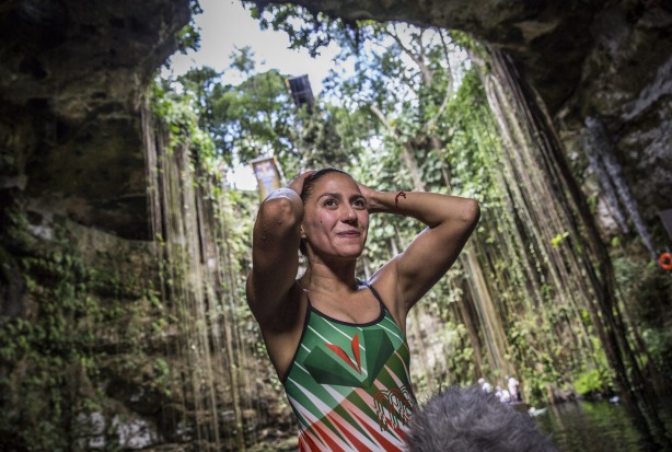 Swimming in Ik Kil cenote, Yucatan, Mexico.