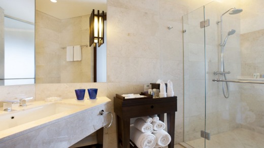 Family adventure suites at the Holiday Inn Resort Bali Benoa have a separate bathroom with rubber duck shower head and ...