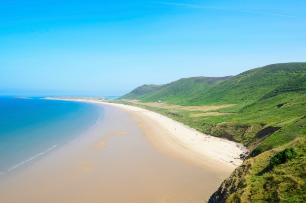 Rhossili Bay Beach, Gower Peninsula, Wales. A beautiful expanse of pristine sand often voted one of the world's best beaches.