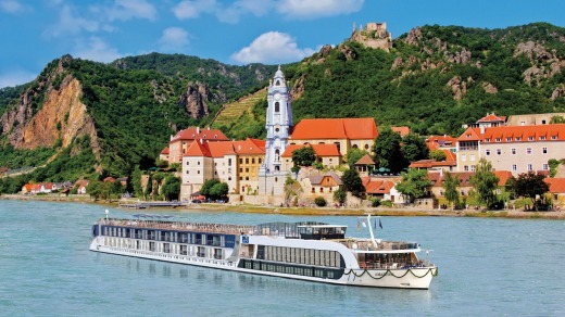 See Europe by river. Here, an APT ship cruises past Durnstein on the Austrian Danube.