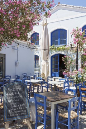A typical greek restaurant on a sunny day in Vathi the capital of Ithaki, Greece.