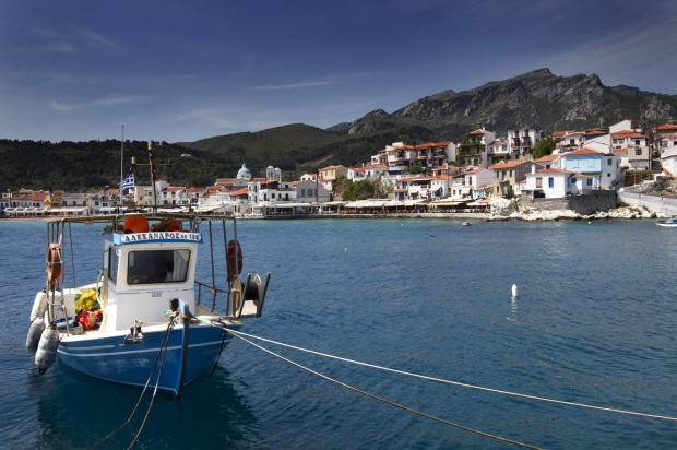 A Greek 'Caique' fishing boat moored in Kokkari bay, on the Greek island of Samos.