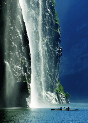 Ponant passengers  kayak in the Norwegian fjords.