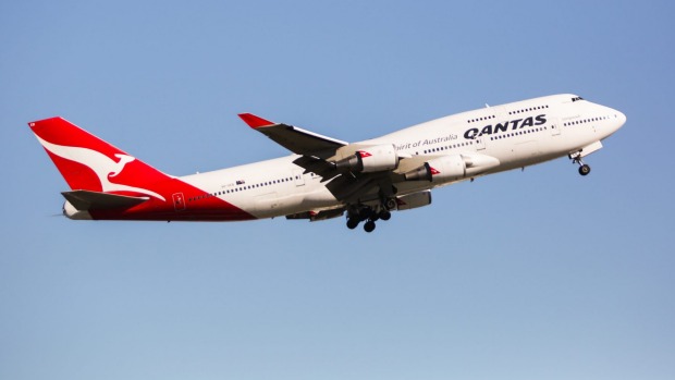 A man had to be restrained and removed from a Qantas flight from Perth to Sydney on Sunday after be became aggressive.