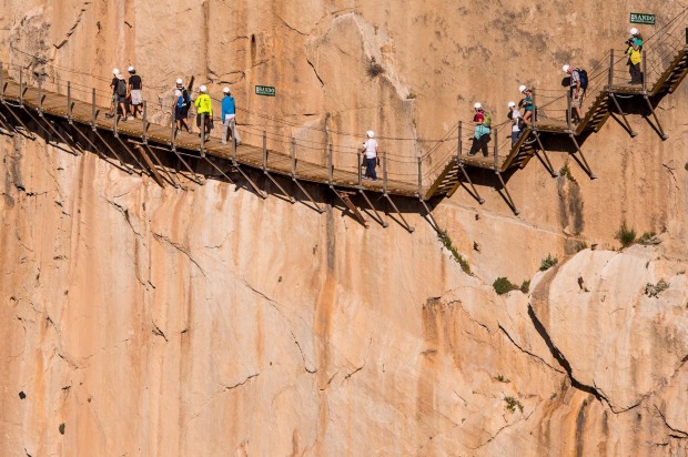 Tourists walk along the 'El Caminito del Rey' (King's Little Path) footpath in Malaga, Spain. 'El Caminito del Rey', ...