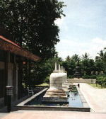 Bell shaped stupas in the pond
