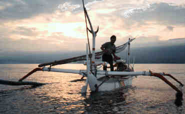 Shortly before dawn, take a boat out about a mile offshore from Lovina Beach to watch the sunrise and the dolphins jumping!