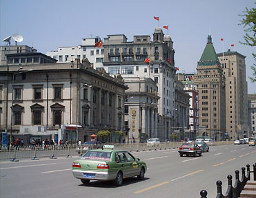 Another view of the Bund. The building with the green-pyramid roof is the Peace Hotel.
