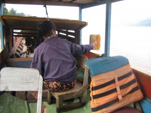 Captain's Wife Bailing Water From Vessel