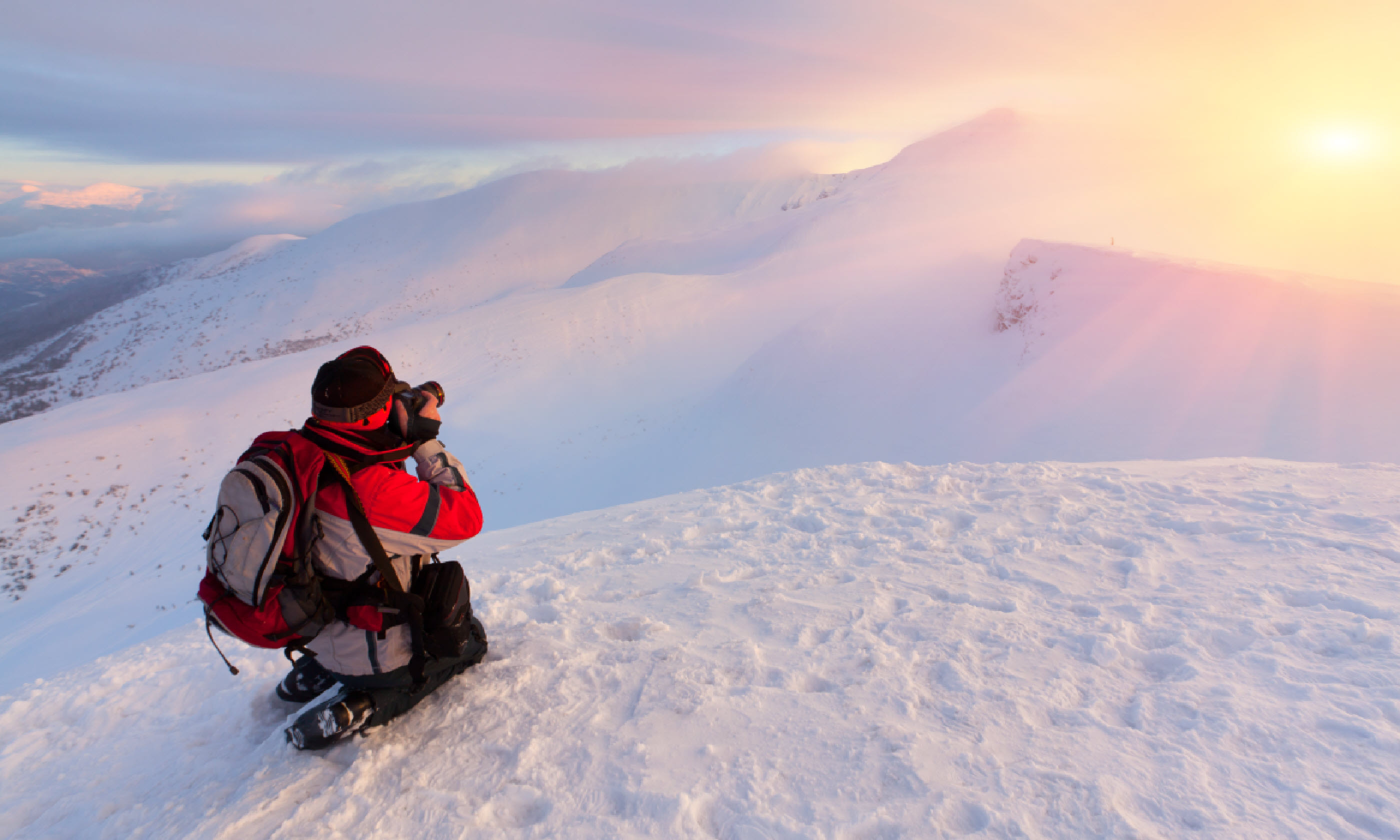 Photographer in the mountains (Shutterstock)
