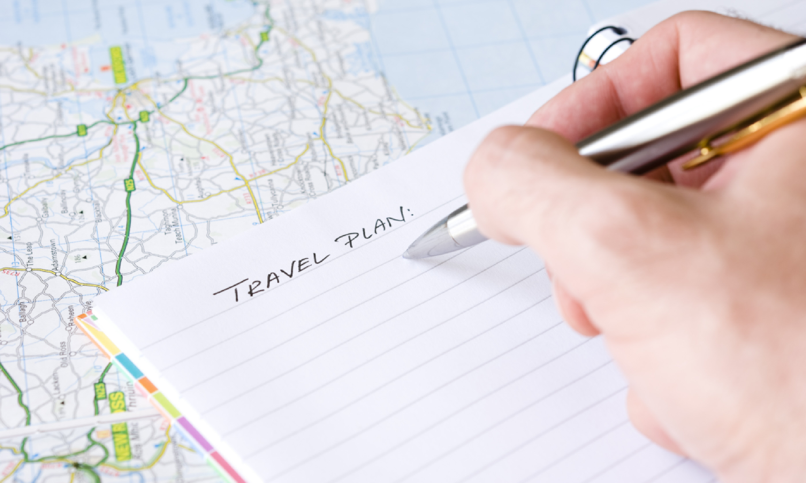 Writing travel plans (Shutterstock)