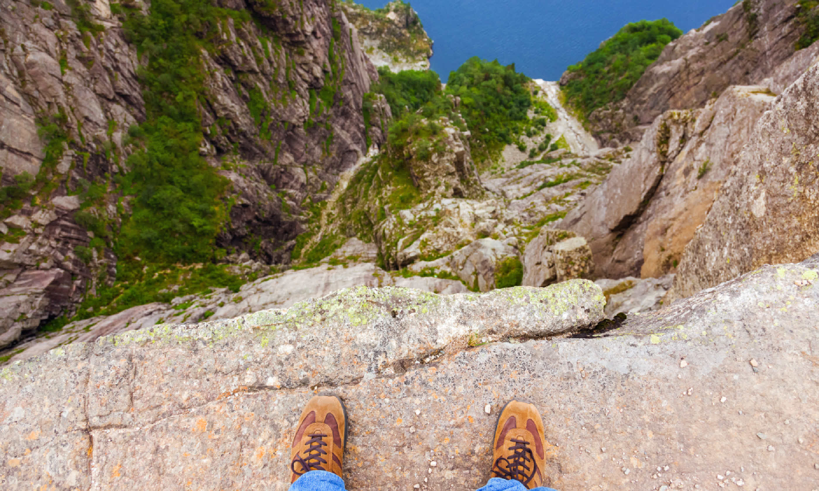 Man standing on cliff (Shutterstock)