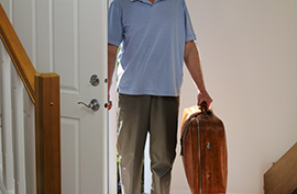 suitcase man returning home