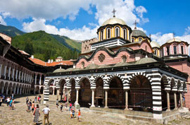 a monastery with people in front of it