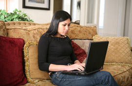 laptop computer woman sofa couch living room