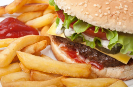 a hamburger, French fries and ketchup